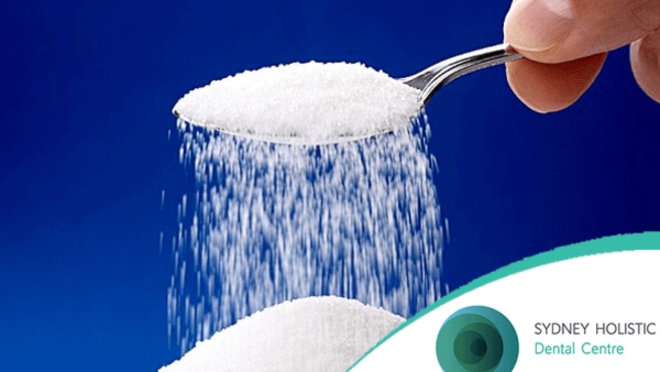 Sugar pouring from a spoon