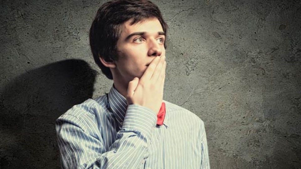 Man covering his mouth