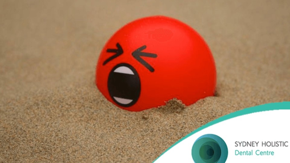 Red stress ball with distressed expression